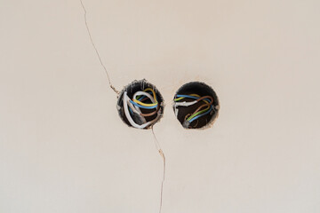 Wiring and electrical work in damaged wall sections during home renovation
