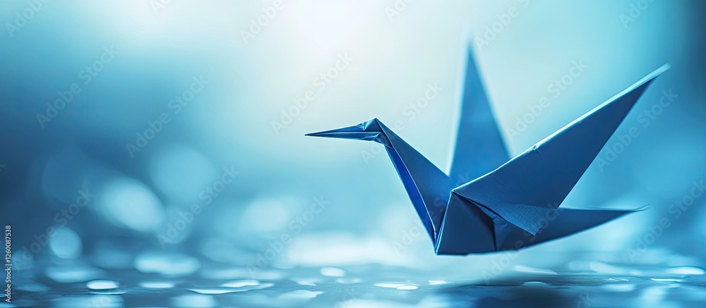 Fototapete blue origami paper crane elegantly positioned in the foreground against a soft blue gradient backgro