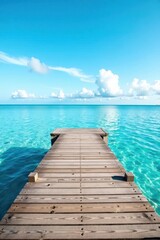 Fototapeta premium Rustic wooden dock extends into calm blue sea, bright sky backdrop , water, light, coast