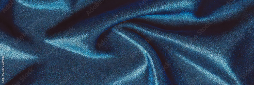 Poster navy blue suede fabric displaying smooth texture and deep shadows in cool lighting