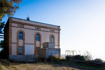 Montjuic lighthouse in the Montjuic hill in Barcelona, Catalonia. Old lighthouse overlooking the...