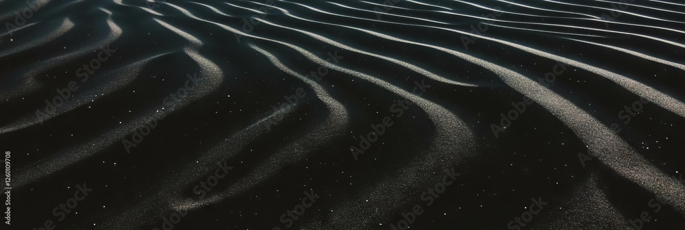 Poster Black sand dune with rippled texture and soft lighting creating unique patterns