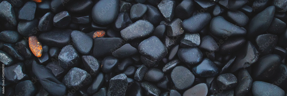 Poster dark sand with pebbles displays uniform texture and varied sizes across the surface