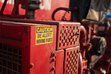 Caution safety sign of moving part inside the machine, dangerous for hand and finger injury....