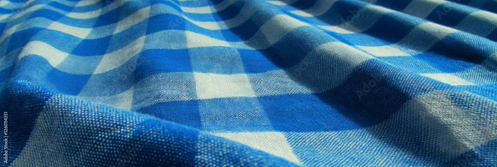 Poster soft blue cotton tablecloth with a large checkered pattern perfect for casual dining settings