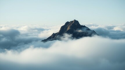 Isolated Mountain Peak Above the Clouds
