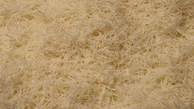 Kataifi dough, rotation in circle. shredded phyllo dough, Turning. Raw kunafa dough. kataifi, dough, filo, rotation, phyllo, kunafa, shredded, raw, circular, kunafa dough, turning, pastry, strands, tr