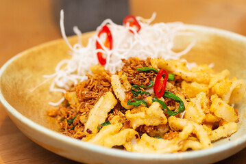 Chinese fried squid with vegetables, chili and spices, Asian cuisine.