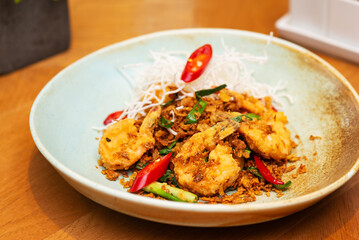 Fototapeta premium Chinese fried tiger prawns with chili, onion and herbs, Asian lunch.