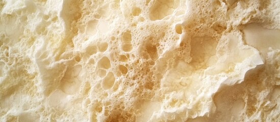 Creamy marble panel close-up with intricate veining and textured surface in soft beige tones ideal for architectural design applications