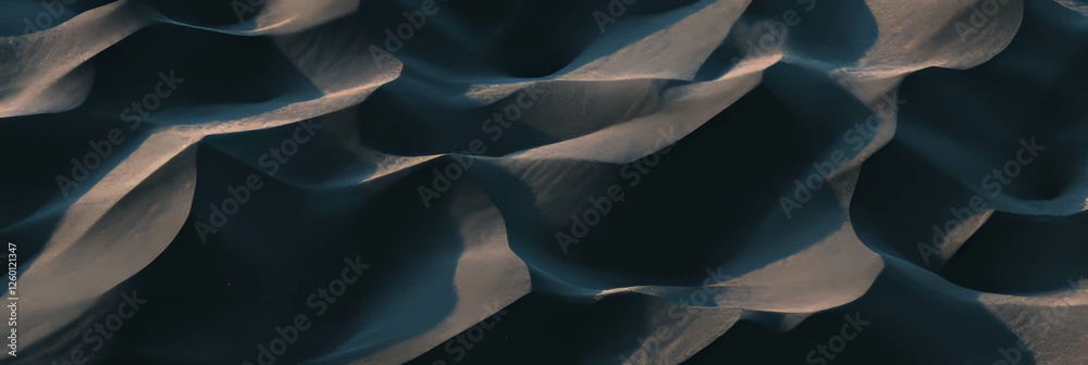 Poster exploring the intricate texture of coarse black volcanic sand with angular grains