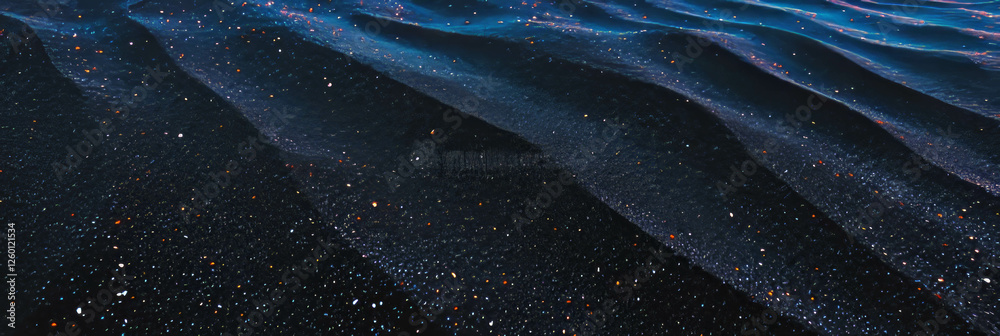Poster texture of compacted black sand with smooth surface and subtle tire tracks