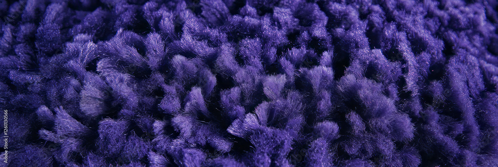 Poster Dense loop pile carpet texture in deep violet showcasing uniform small loops in even lighting