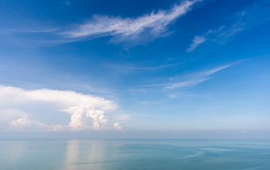 View of blue sky and ocean with white cloud