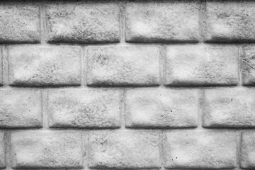 Texture of a gray concrete brick wall in a construction site setting