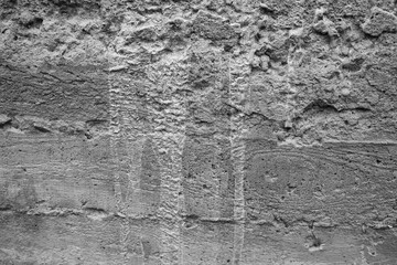 Textured wall surface with intricate patterns in monochrome tones
