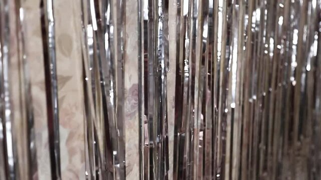 Shimmering tinsel curtain reflecting light