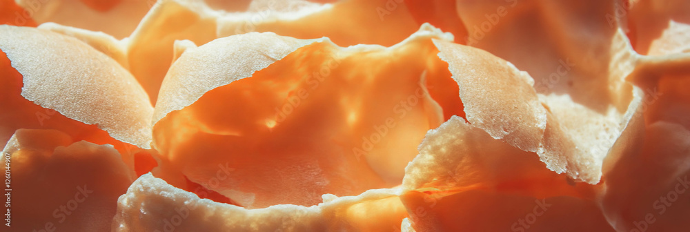 Poster Light brown cone wafer showcasing irregular shapes and crumbly texture in close-up view