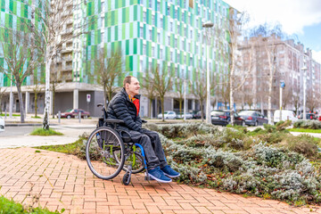 Disabled man enjoying a day out in the city with wheelchair