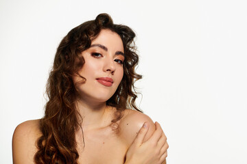 Fototapeta premium Stylish young woman posing with confidence in a creative studio setting