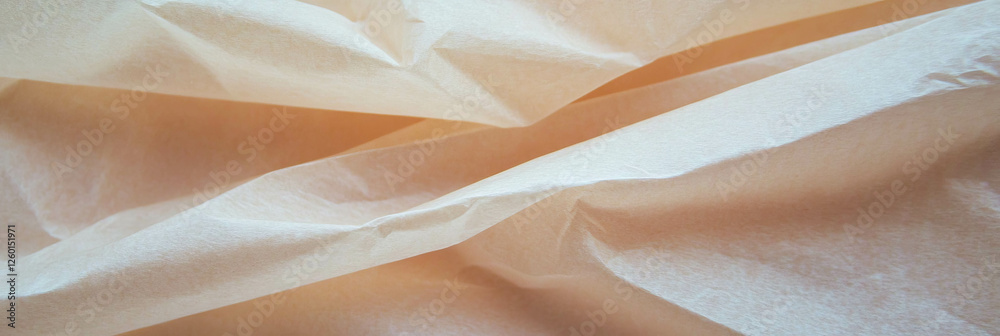 Aufkleber light tan paper with interwoven fibers displaying smooth texture and subtle creases