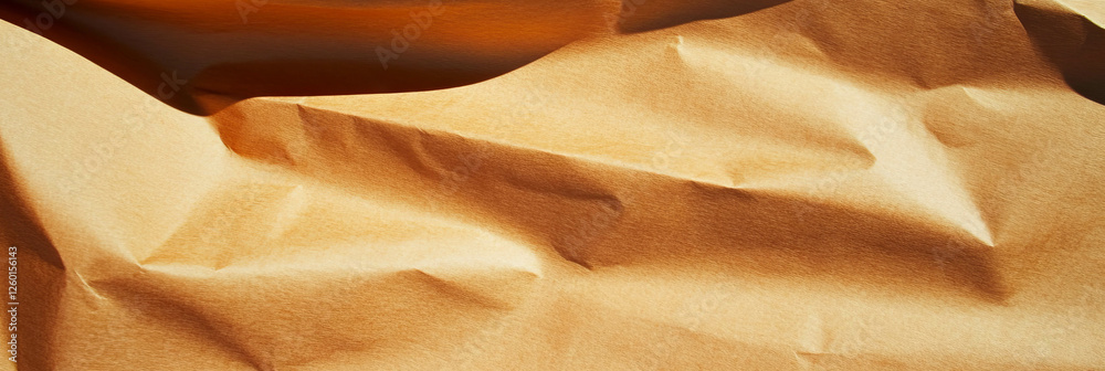 Aufkleber Texture of medium brown paper with subtle grain and uneven surface in a creative setting
