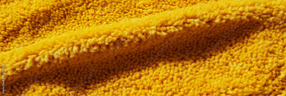 Poster mustard yellow dense loop pile carpet with uniform texture and even lighting in interior space