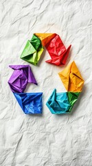 colorful origami recycling symbol on textured white background, creative and vibrant depiction of sustainability, artistic clean design