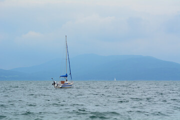 Fototapeta premium Boat in a lake in a cloudy day