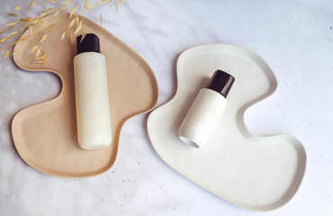 Face cream and tonic in marble tray 