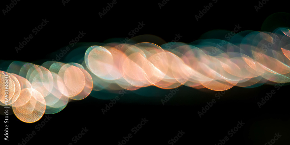 Aufkleber overlapping and isolated bokeh creates shimmering light effects on a black background