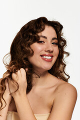 Stylish young woman with curly hair joyfully showcasing her vibrant personality