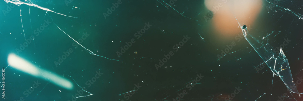 Poster texture of scratched film showing angular scratches and uneven grain with harsh lighting effects