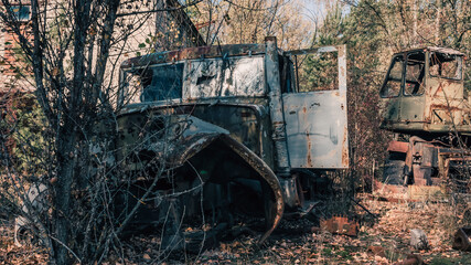 Fototapeta premium old abandoned wrecked vehicle in Chernobyl