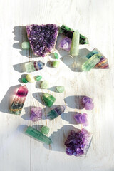 set of Crystal minerals close up on white rustic wooden background. Witchcraft, Magic crystal...
