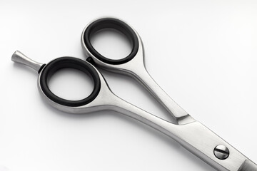 Scissors handles on a white stainless steel background
