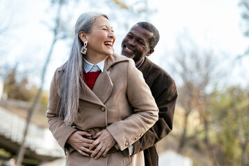 Storytelling image of a multiethnic senior couple in love