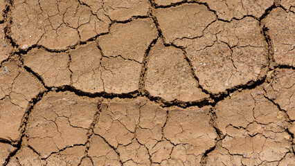 dried soil. drought-cracked lake floor photos