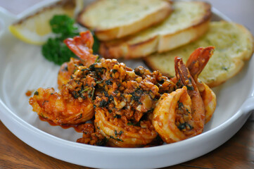 stir fried shrimp or Gambas al Ajillo or Shrimps pan fried with extravirgin olive oil and garlic with toast