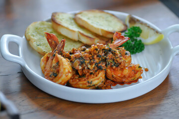 stir fried shrimp or Gambas al Ajillo or Shrimps pan fried with extravirgin olive oil and garlic with toast