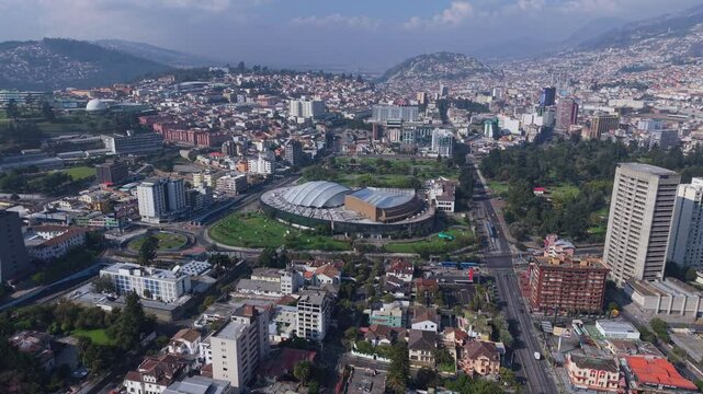 Aerial view of Quito, Ecuador, showcasing the Casa de la Cultura Ecuatoriana and surrounding urban landscape with traffic, urban parks and building