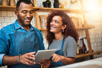 Cafe, couple and order with tablet for small business, hospitality inventory and teamwork for startup. Coffee shop, man and woman by flare for customer service, restaurant management and partnership