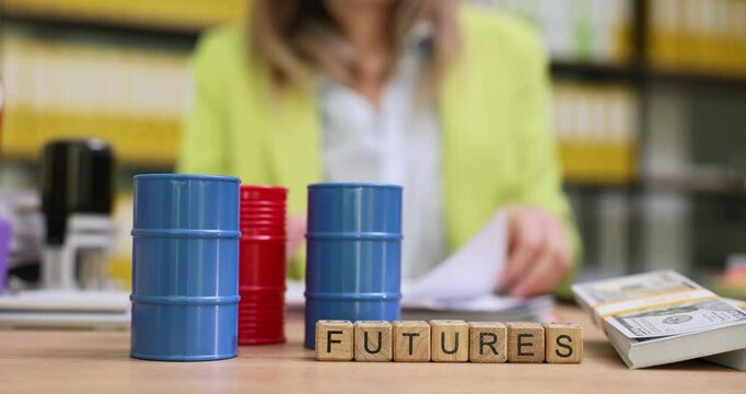 Word Futures on blocks near mini oil barrels and dollars against successful businesswoman. Female manager predicts potential earnings from deal at workspace