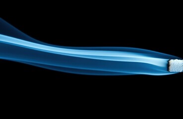 Fototapeta premium Blue smoke trail from a square object on black background