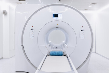 A high-angle shot of a CT scan machine room, showing the advanced medical imaging equipment and the...