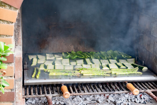 Barbecue of green peppers, zucchini and green asparagus. Outdoor smoked grill. Copy space.