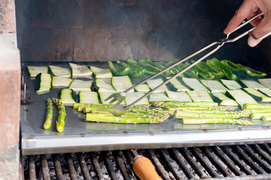 Barbecue of green peppers, zucchini and green asparagus. Outdoor smoked grill. BBQ. Horizontal image.