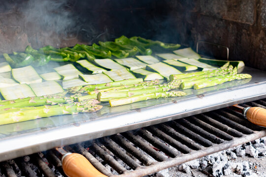 Barbecue of green peppers, zucchini and green asparagus. Outdoor smoked grill. BBQ.