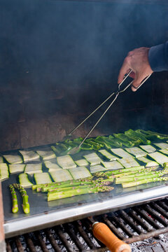 Barbecue of green peppers, zucchini and green asparagus. Outdoor smoked grill. BBQ. Vertical image.