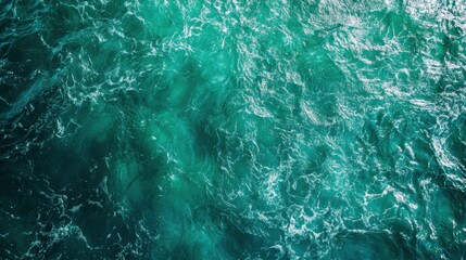 Obraz premium Serene turquoise ocean waves with gentle ripples and sunlight